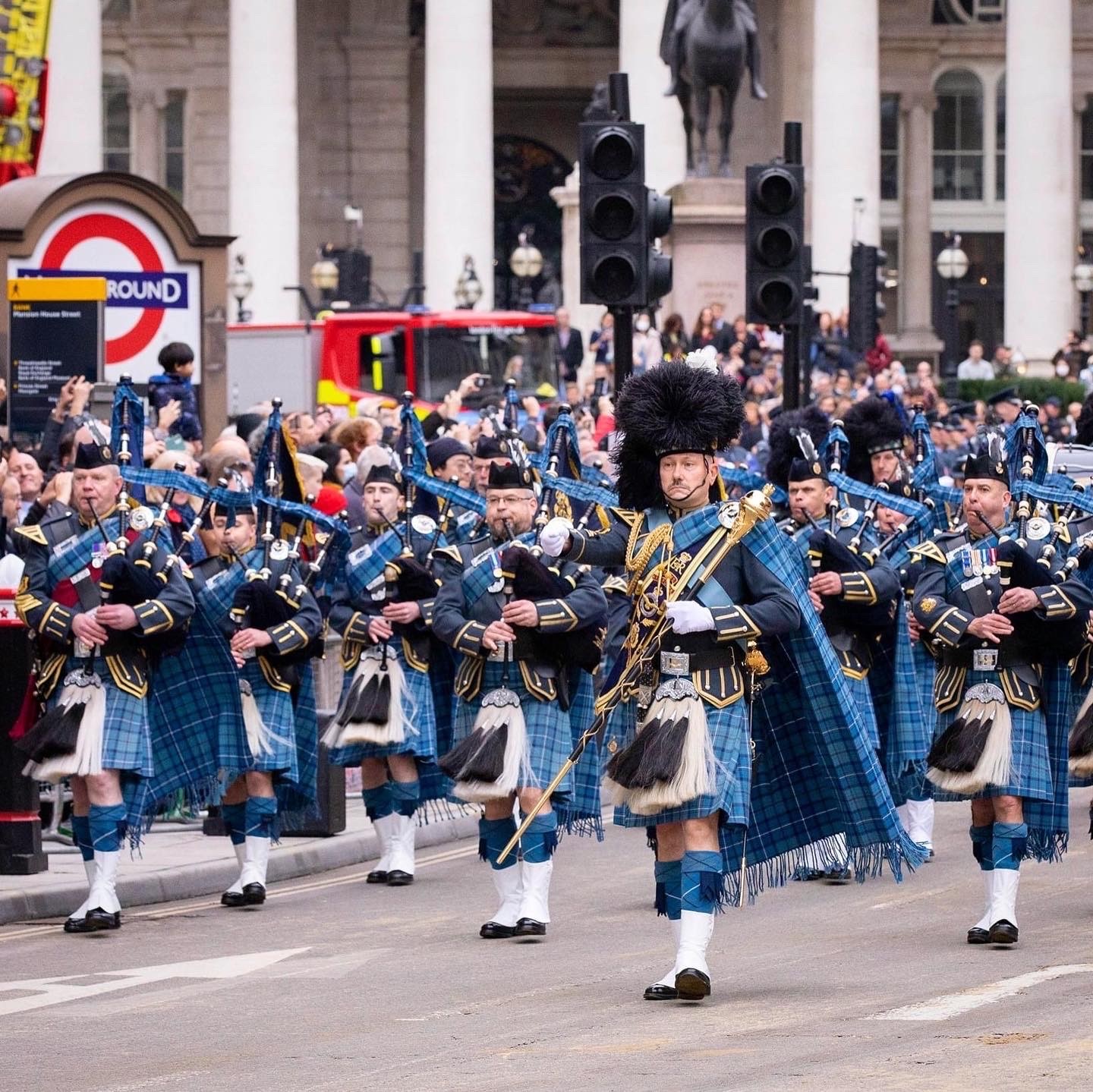 Image shows RAF Pipes and Drummers parading in London.